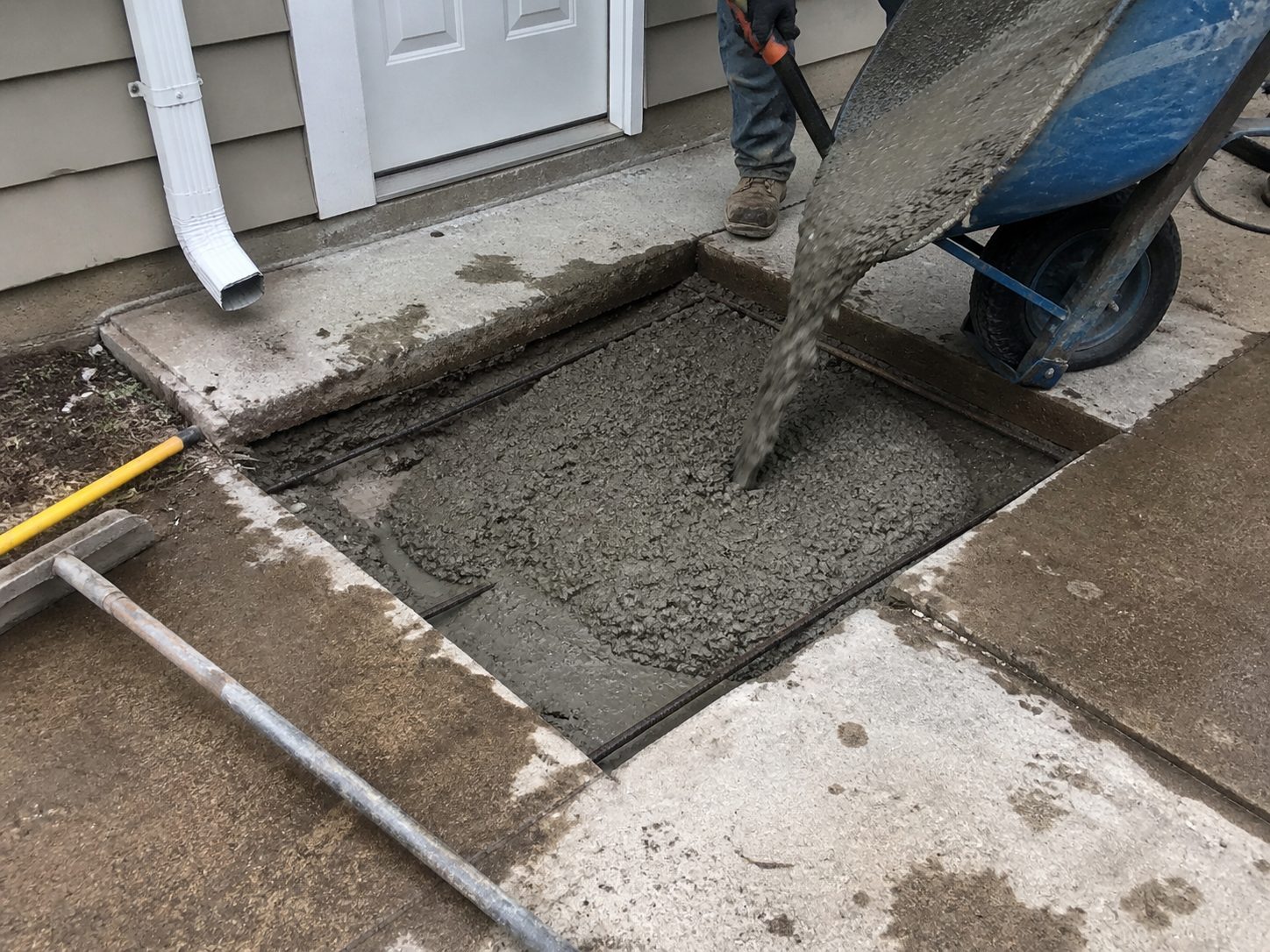 Concrete repair and replacement work in progress at an Independence, MO residential property