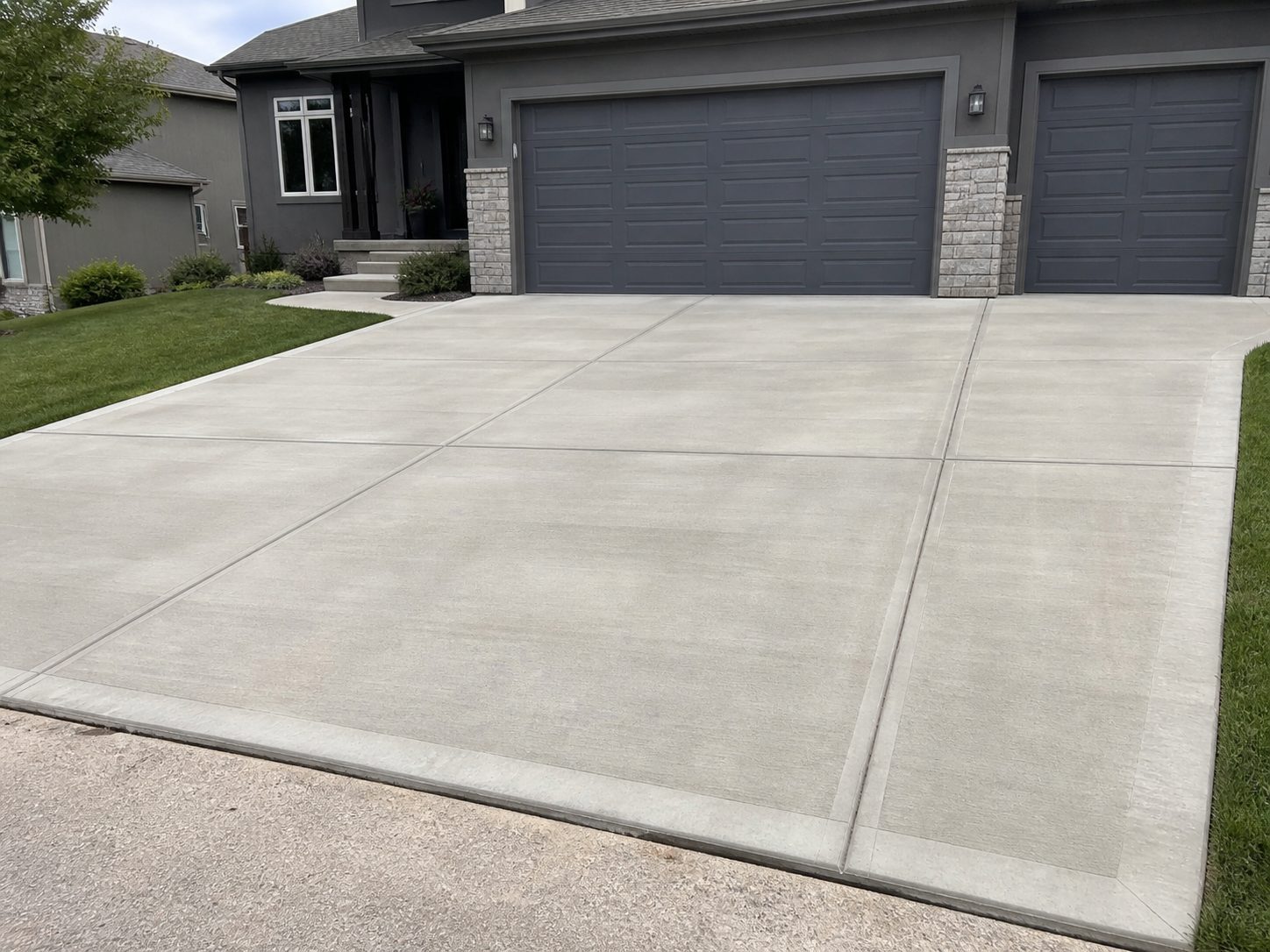 Finished residential concrete driveway at a newer home in the Kansas City east metro area