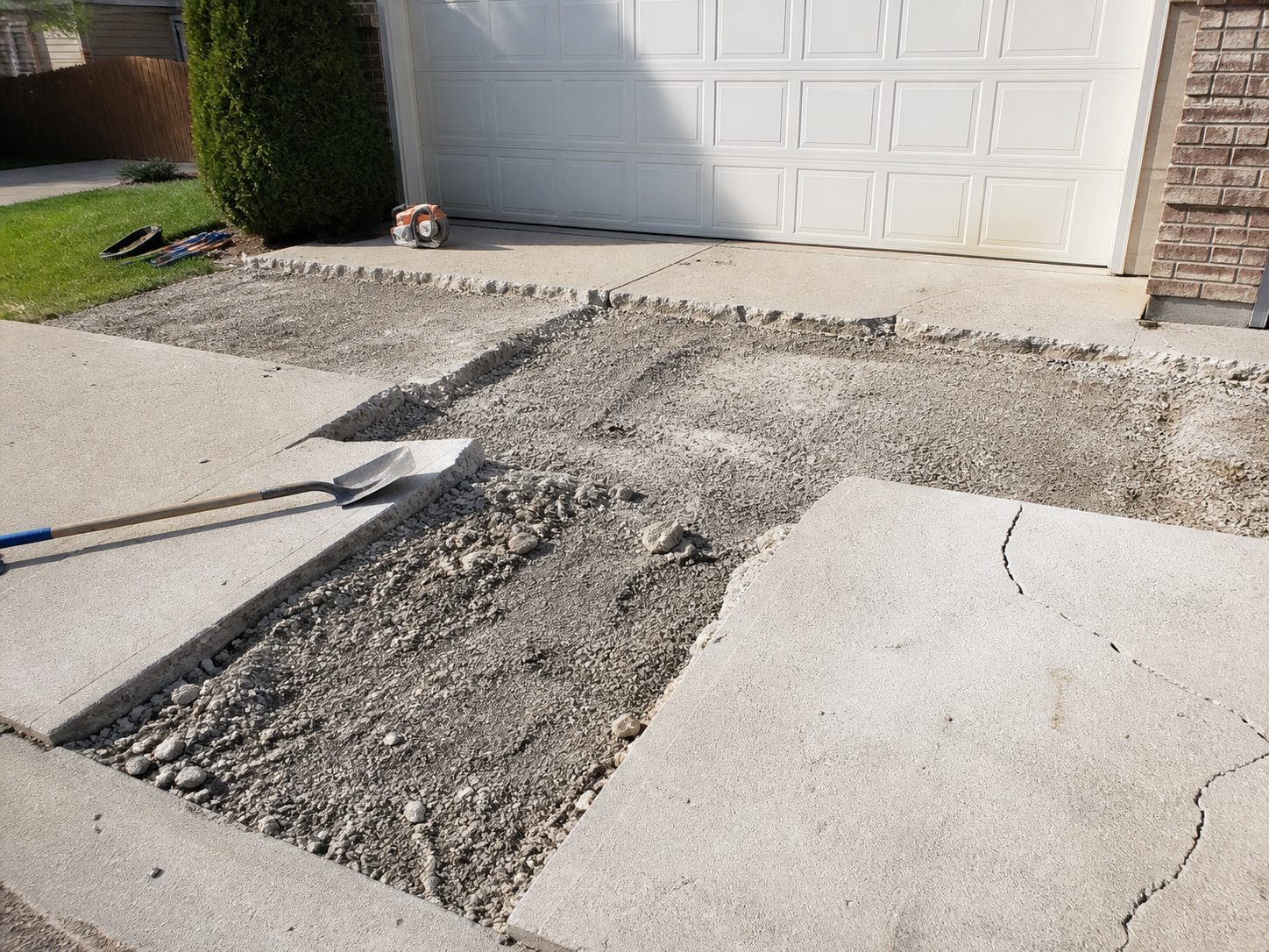 Concrete driveway replacement in progress at a Belton, MO residential property